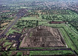 Aerial view of what was once downtown Teotihuacan showing the Pyramid of the Sun, Pyramid of the Moon, and the processional avenue serving as the spine of the city's street system