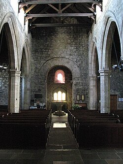 St Andrew's parish church, showing at centre its reused Roman arch, thought to have been brought from the nearby Coria Roman town.