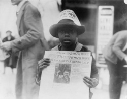 An (est.) seven-year-old newsboy in Washington, D.C. in 1921.