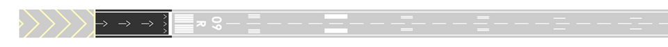 The displaced threshold is the wide white line across the runway, indicated by white arrows leading up to it. The area behind a displaced threshold can be used for taxiing and taking off in either direction, as well as for landings from the opposite direction.