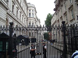 Two armed police officers stand guard in 2009 at the entrance to Downing Street, where the official residence of the prime minister is located.
