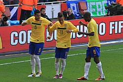 Neymar, Ramires and André Santos celebrating a goal with a dance