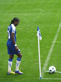 Wigan Athletic player Hugo Rodallega standing by the corner flag, about to take a corner kick