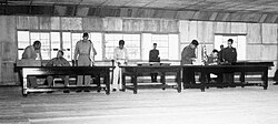 Delegates sign the Korean Armistice Agreement in P'anmunjŏm