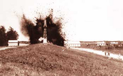 An Army Corps Photo of the levee at Caernarvon being dynamited during the floods of 1927.