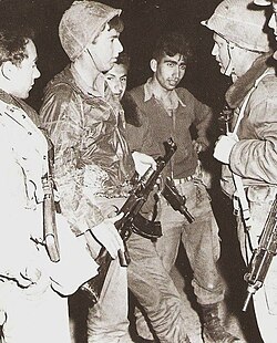 Israeli special forces coordinating an operation in 1960. Different types of firearms are used.