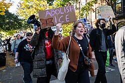 Many Chicagoans began carrying whistles[104] to alert neighbors of observed ICE activity.[105][106] Note the whistles carried here during a protest in the Lincoln Park neighborhood on October 26, 2025.