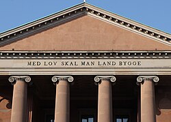 "With law shall land be built", preamble to the Code of Jutland above Copenhagen Court House. In 2023, the World Justice Project ranked Denmark no. 1 on their rule of law index.[110]