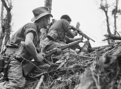 An Australian light machine gun team in action near Wewak, Papua New Guinea, in June 1945