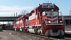An eastbound Terminal Railroad Association of St. Louis freight train passes under the Hampton Avenue viaduct