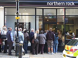 In sociology a network effect can quickly create the positive feedback of a bank run. The above photo is of the UK Northern Rock 2007 bank run.