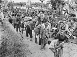 Japanese civilians and soldiers prior to their embarkation to Jesselton after their surrender to the Australian Imperial Force (AIF) in Tawau on 21 October 1945
