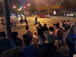 On the night of May 12, residents of Chengdu worried about potential aftershocks gathered in the street to avoid staying in buildings.