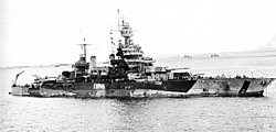 USS Colorado off Tinian, on 24 July 1944, with hull damage, the result of 22 hits from shore batteries