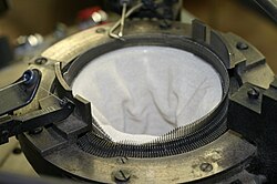 A circular knitting machine.