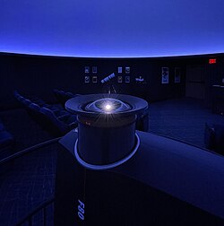 An example of a digital laser projector installed in the Lohman Planetarium at the Museum of Arts and Sciences, Daytona. This Projector employs a fisheye lens to project an image across the entire dome.