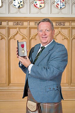 Mike Edwards received his OBE from the King in an investiture at Windsor Castle in July 2023.