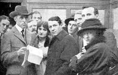Griffith on the set of The Birth of a Nation (1915) with actor Henry B. Walthall and others