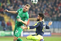 Giroud battling for the ball with Cosmin Moți of Ludogorets in a UEFA Champions League match in November 2016