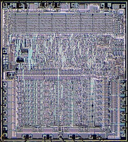 Die photograph of a MOS 6502, an early 1970s microprocessor integrating 3500 transistors on a single chip