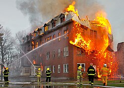 A building in Massueville (Quebec, Canada) engulfed by fire