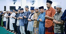 While standing in prayers, worshipers recite the first chapter of the Quran, al-Fatiha, followed by any other section