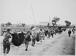 A burial detail of American and Filipino POWs killed during the Bataan Death March, 1942