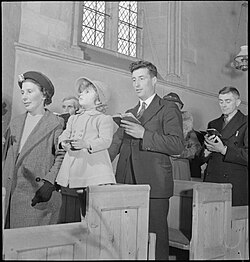 In Christianity, church congregations often sing hymns together as part of their worship (Pictured: worshippers at Uffington Parish Church in England, 1944)