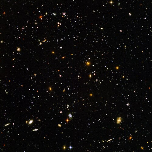 The deepest visible-light image of the universe, the Hubble Ultra-Deep Field. The vast majority of objects seen above are distant galaxies.