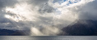 Sunlight shining through clouds, giving rise to crepuscular rays.
