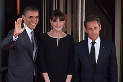 Sarkozy and his wife Carla Bruni greet President Barack Obama at the G8 Summit dinner in Deauville, France, 26 May 2011.