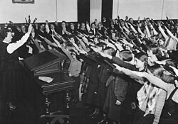 The Nazi salute in school (1934): children were indoctrinated at an early age.