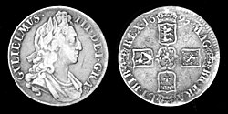 A silver coin picturing William III and his coat of arms