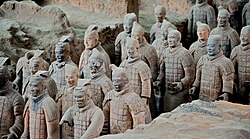 A group of the Terracotta Warriors standing in an archaeological dig site