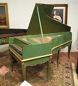 A grand piano by Louis Bas of Villeneuve-lès-Avignon, 1781. Earliest French grand piano known to survive; includes an inverted wrestplank and action derived from the work of Bartolomeo Cristofori (c. 1700) with ornately decorated soundboard.