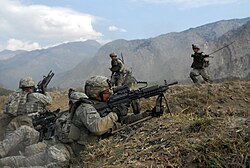 United States Army soldiers engaged in a firefight with Taliban insurgents during the War in Afghanistan, 2009