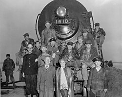 South Korean president Syngman Rhee and his wife posing with US Army Corps of Engineers personnel at the Han River Bridge in 1950
