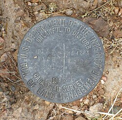 BLM cadastral survey marker from 1992 in San Xavier, Arizona.