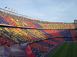 A view of the supporters' side during a match, showing the FC Barcelona colours