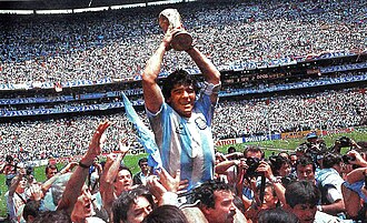 Diego Maradona raising the FIFA World Cup trophy at the Estadio Azteca in Mexico City.