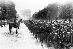 German soldiers march near the Arc de Triomphe in Paris, 14 June 1940