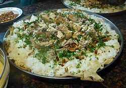 Mansaf, the traditional dish of Jordan, originates from Bedouin life and is a symbol of Jordanian hospitality.