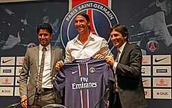 Ibrahimović unveiled by Paris Saint-Germain sporting director Leonardo Araújo (right) and President Nasser Al-Khelaifi (left)