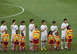 South Korean players saluting the national flag at the 2010 FIFA World Cup