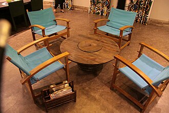 An electric wire reel reused as a center table at a Rio de Janeiro decoration fair