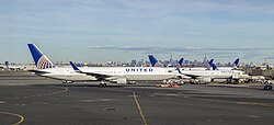View of the Manhattan and Jersey City Skyline from Newark Airport with United Airlines planes serving the airport in October 2016