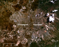NASA satellite image showing the Choluteca River separating Tegucigalpa and Comayagüela