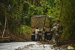 Debris-clogged roads added to logistical challenges faced by rescue and relief crews.