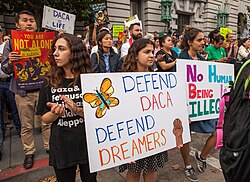 At a Deferred Action for Childhood Arrivals (DACA) rally in San Francisco, protesters displayed a variety of signs and banners advocating for the protection and expansion of the DACA program.