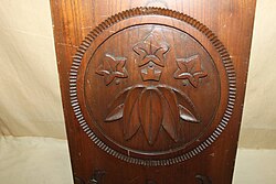 A wooden signboard with a family crest of Minamoto clan (sasa-rindou)